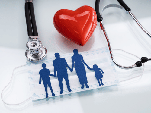 Medical symbols and a mask with a family silhouette represent health and protection for families